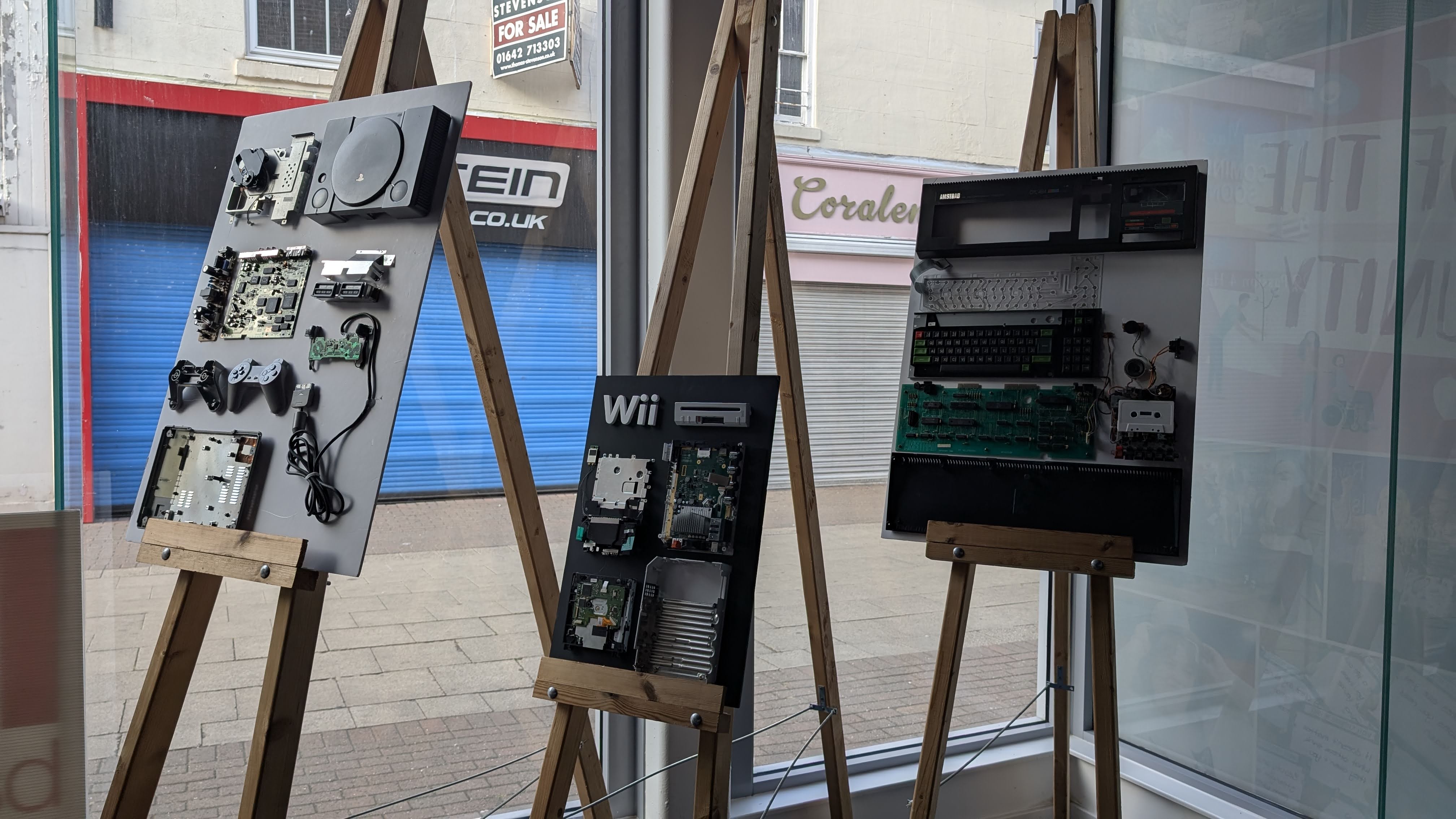Exploded display boards showing consoles and computers